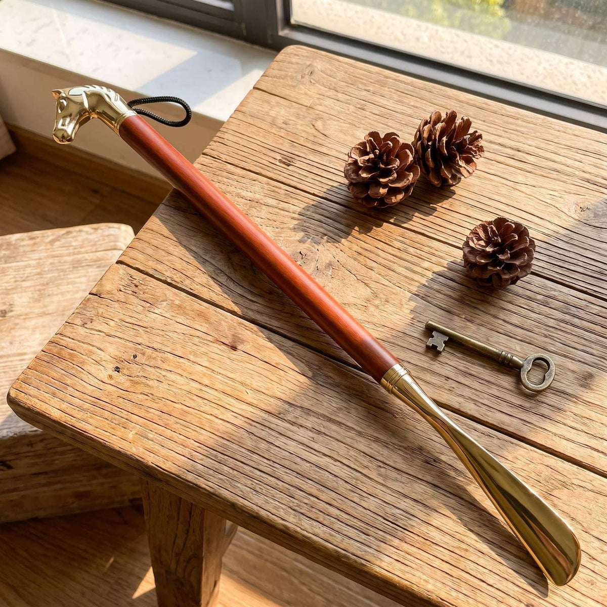 Lyle's long shoe horn with gold horse head and hardwood handle