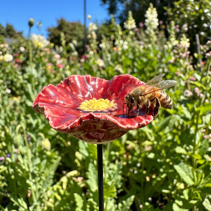 Hand-glazed rim of a bee blossom with a honeybee