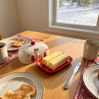 Two sticks of butter side by side on the Reindeer butter dish tray