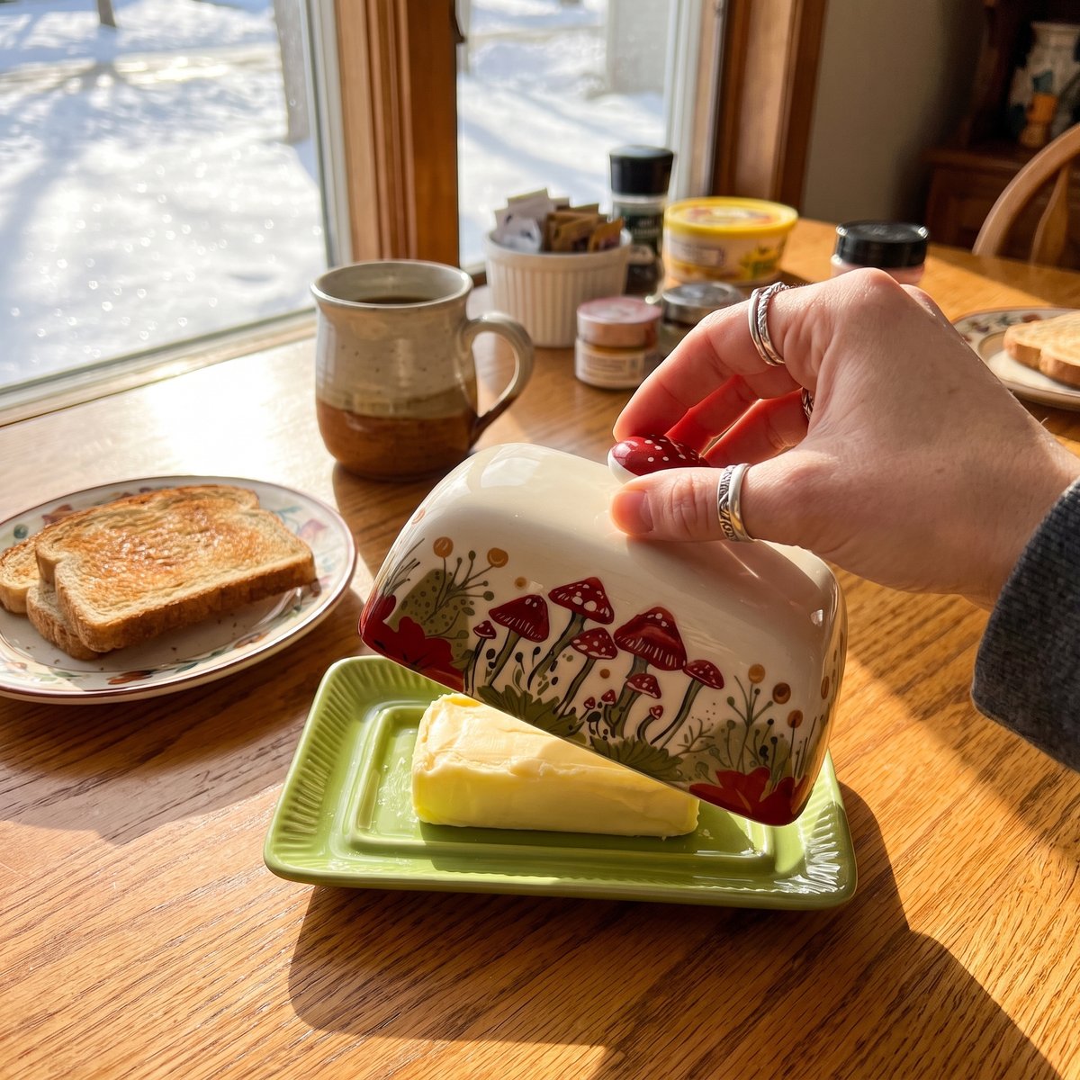 Lifting the dome of the Mushroom butter dish