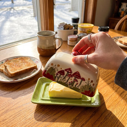 Lifting the dome of the Mushroom butter dish