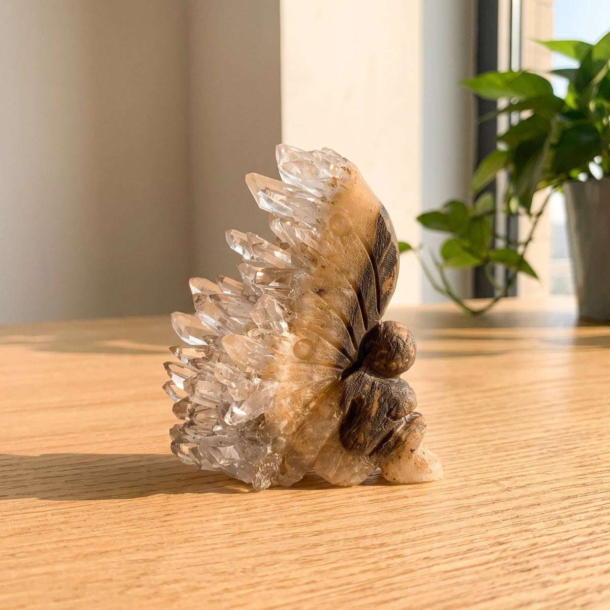 Marlene's hand-carved crystal fairy with a natural quartz wing