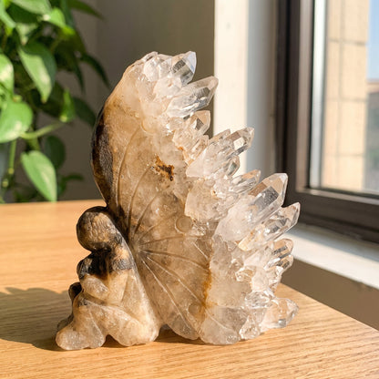 Marlene's hand-carved crystal fairy with a natural quartz wing
