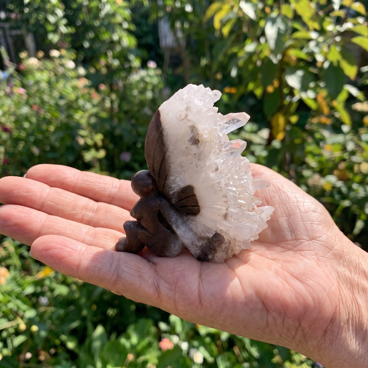 Marlene's hand-carved crystal fairy with a natural quartz wing