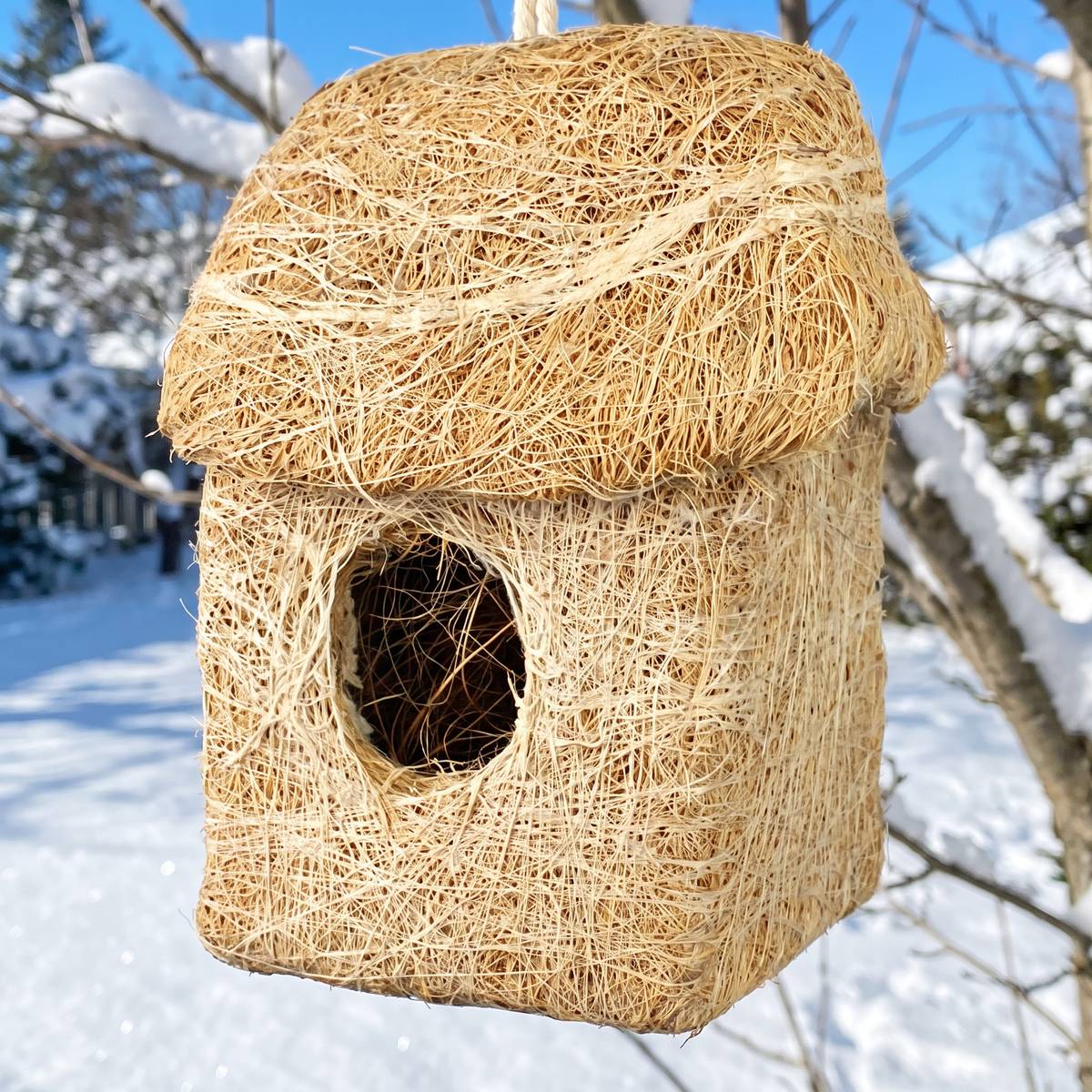 Close-up of the packed coconut fibre walls and round door