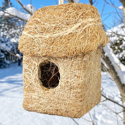 Close-up of the packed coconut fibre walls and round door