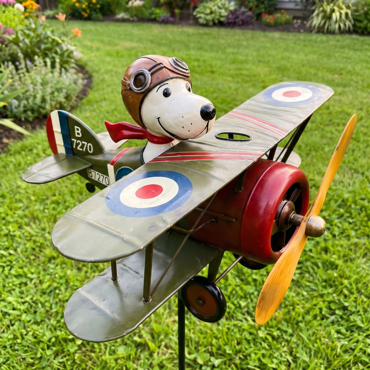 Close-up of the Flying Ace cartoon pilot, olive-green wing and RAF roundel