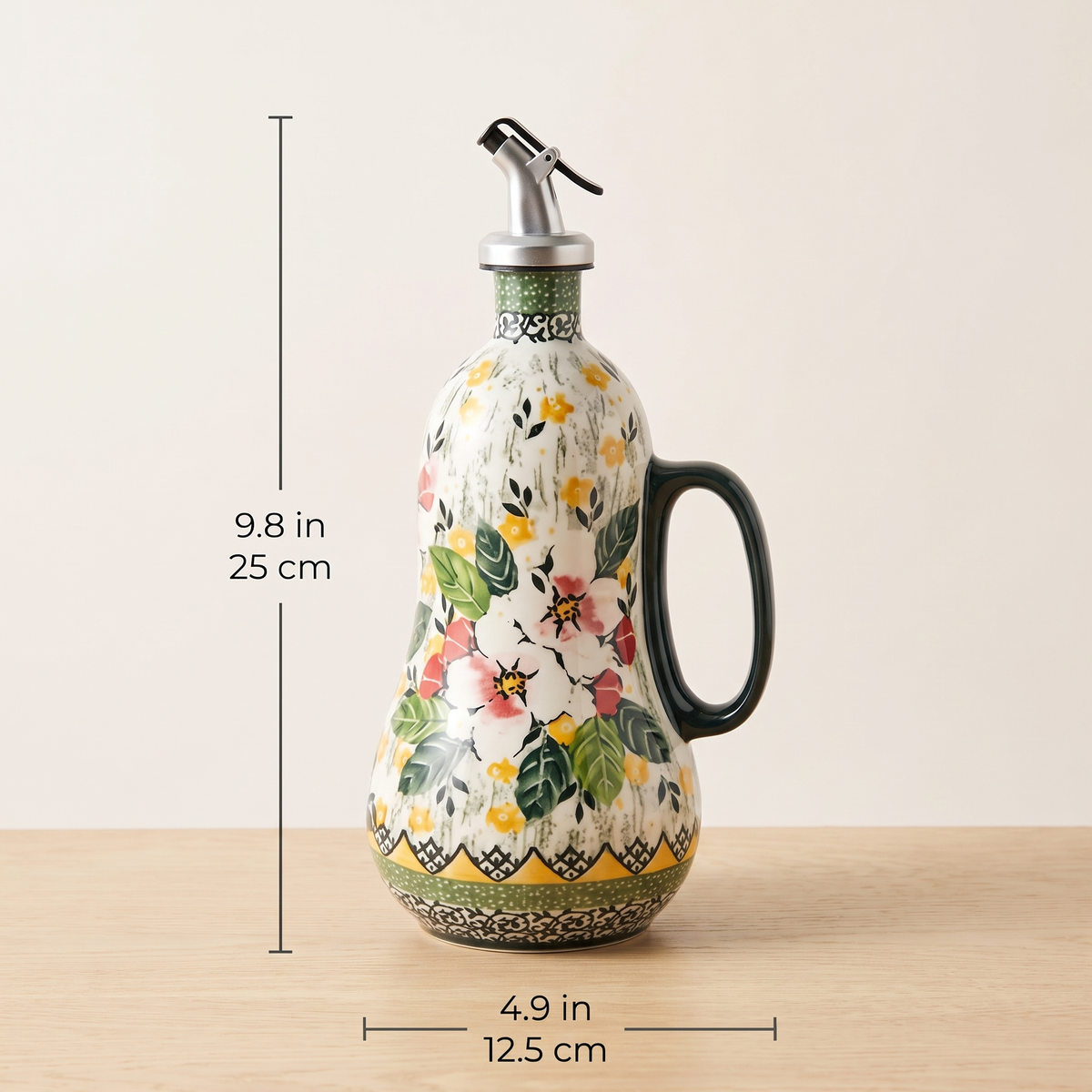 Oil dispenser dimensions: 9.8 in tall, 4.9 in wide including the handle
