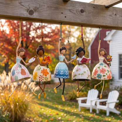 All five hand-painted wind dancers hanging from a pergola beam in a fall garden