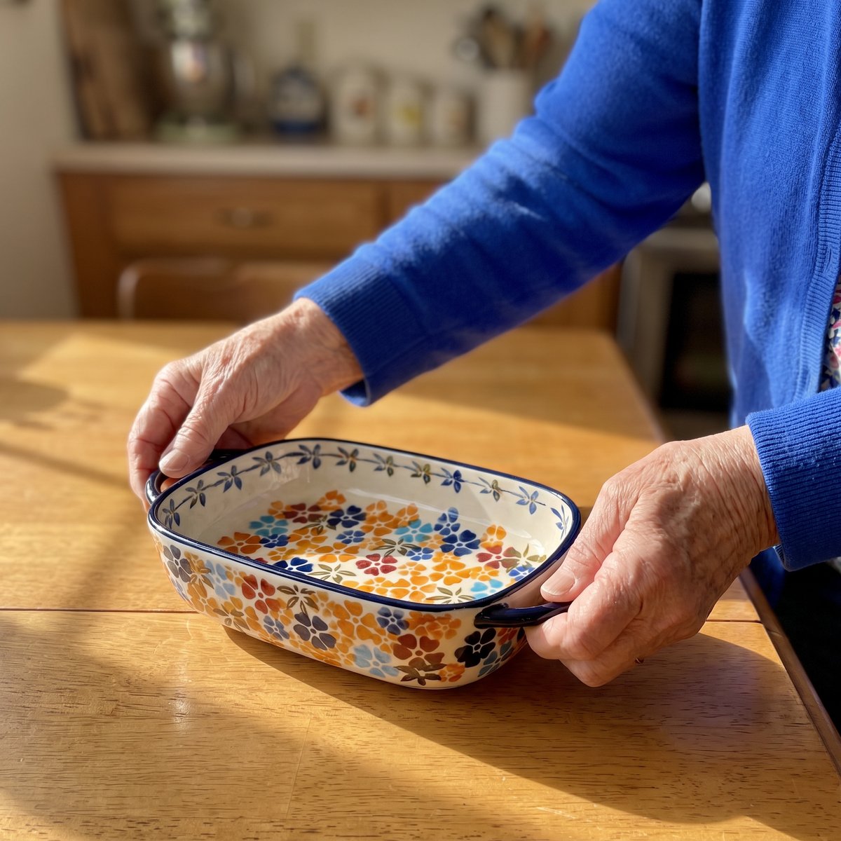 Bernice setting down a Wildflower baking dish