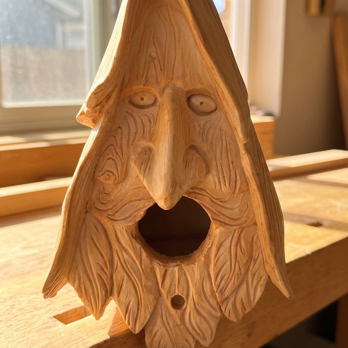 Close-up of the hand-carved eyes, nose and wrinkles
