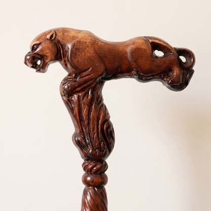 Close-up of the carved leopard grip stretching along the handle